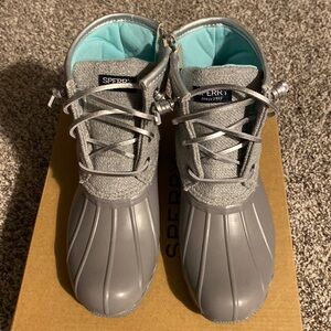 Gray and silver Sperry boots